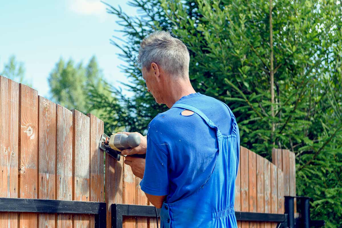How to Maintain a Painted or Stained Wood Fence 