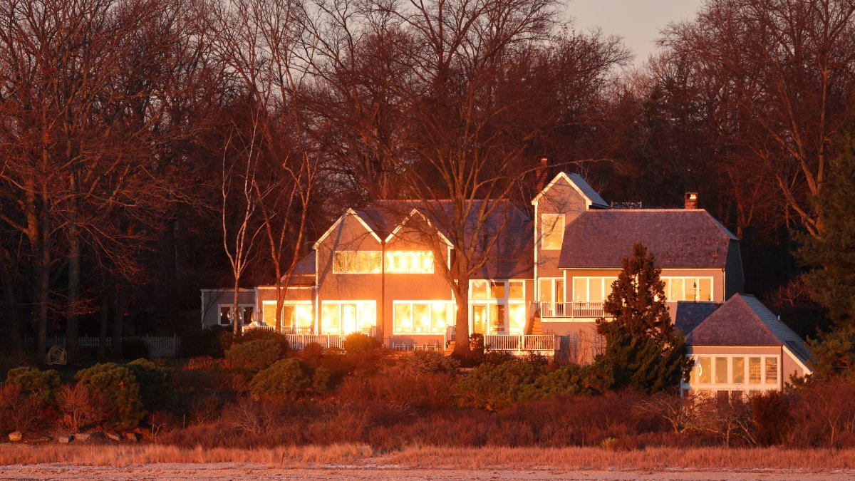Lakeside house surrounded by trees